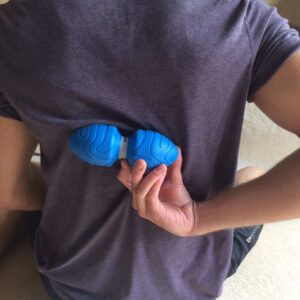 Working on spine mobility with the double lacrosse ball